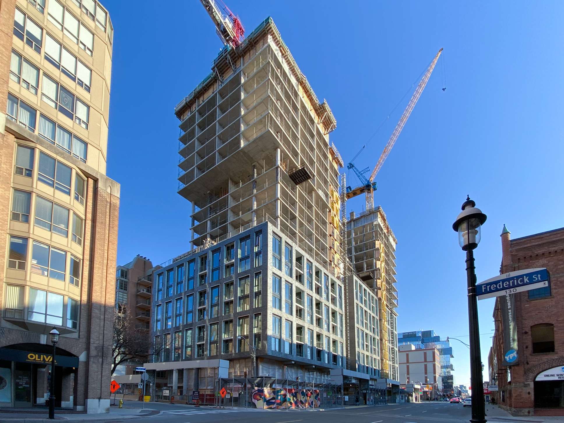 St. Lawrence Condominiums’ cantilevered profile emerging as its two towers near final height